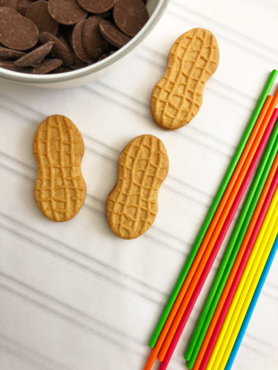 Football Pops, Tailgating Dessert, Tailgating Recipe, Dessert Recipe Lay out a piece of parchment paper onto a baking sheet and aside. In a small microwave safe bowl, heat 2 cups of light cocoa candy melts on 50% power in the microwave for 3 to 4 minutes, stirring every 30 seconds until melted.