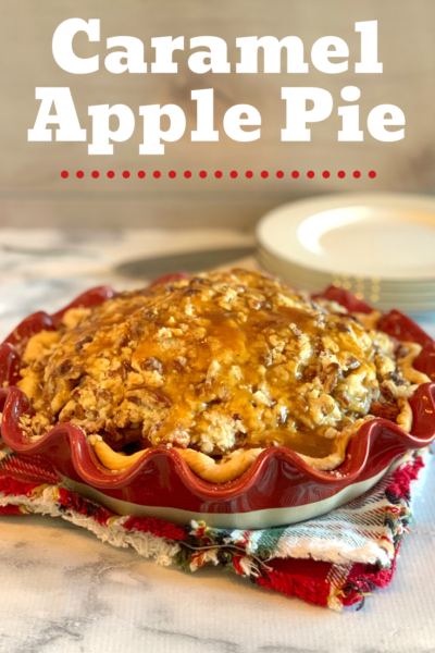 This Caramel Apple Pie recipe is the most decadent fall pie. Serve with vanilla ice cream, while enjoying the sweet caramel, pecans and baked apples. #Apple #ApplePie #AppleRecipe #DutchApplePie #CaramelApple