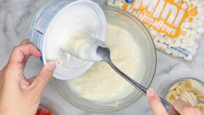 Fold in Cool Whip topping to the salad Fold in Cool Whip topping to the salad