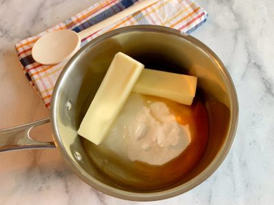 Combining butter, sugar and salt in saucepan Combining butter, sugar and salt in saucepan
