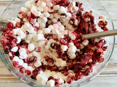 Folding marshmallows into the cranberry mixture Folding marshmallows into the cranberry mixture