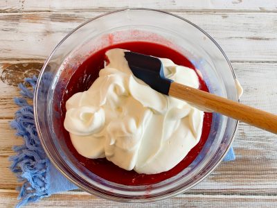 Folding in the whipped cream to the Cranberry Folding in the whipped cream to the Cranberry