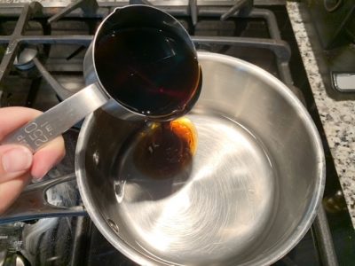 Water and Maple Syrup together over stovetop Water and Maple Syrup together over stovetop
