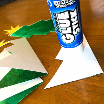 Applying glue to folded Christmas tree Applying glue to folded Christmas tree