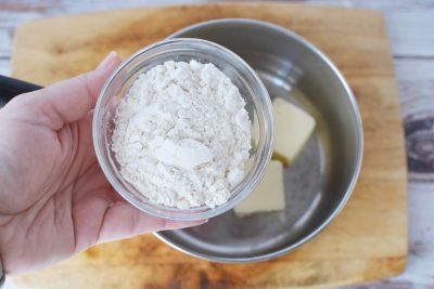 Adding Flour To Butter in Pot Adding Flour To Butter in Pot