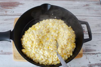 Adding creamed corn to skillet Adding creamed corn to skillet